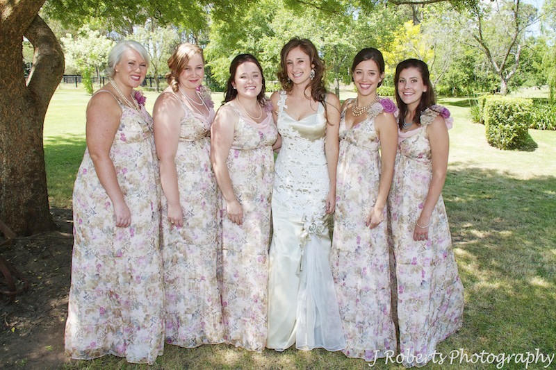 Bride with her bridesmaids in the garden - wedding photography sydney